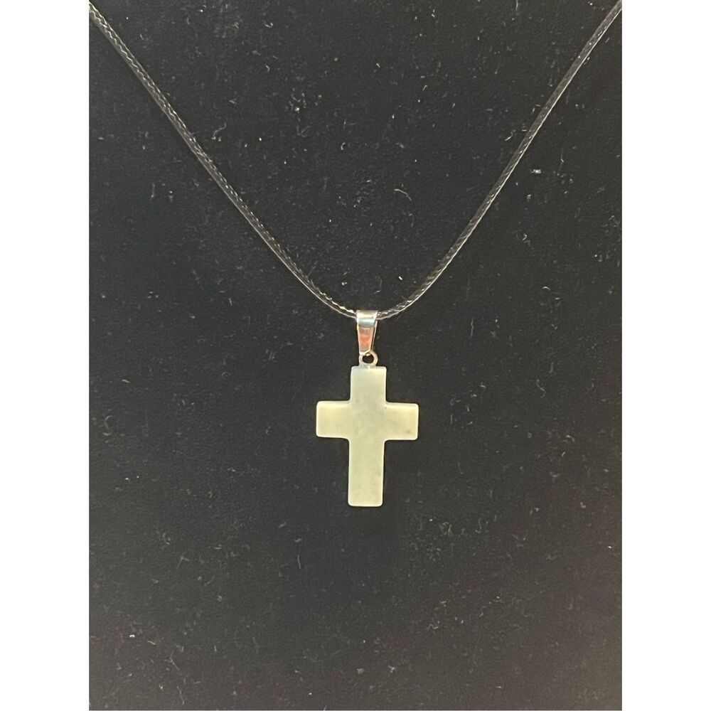 White Stone Cross on a Black Necklace Cord